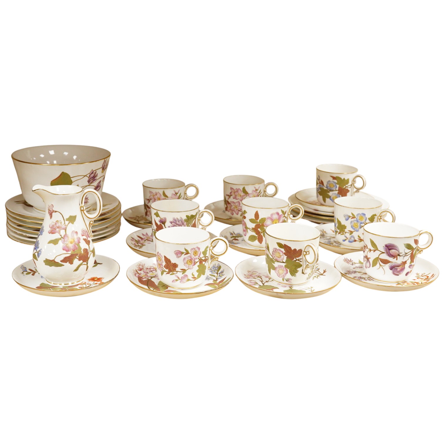 A late Victorian Royal Worcester floral decorated tea service, milk jug 13cm high.